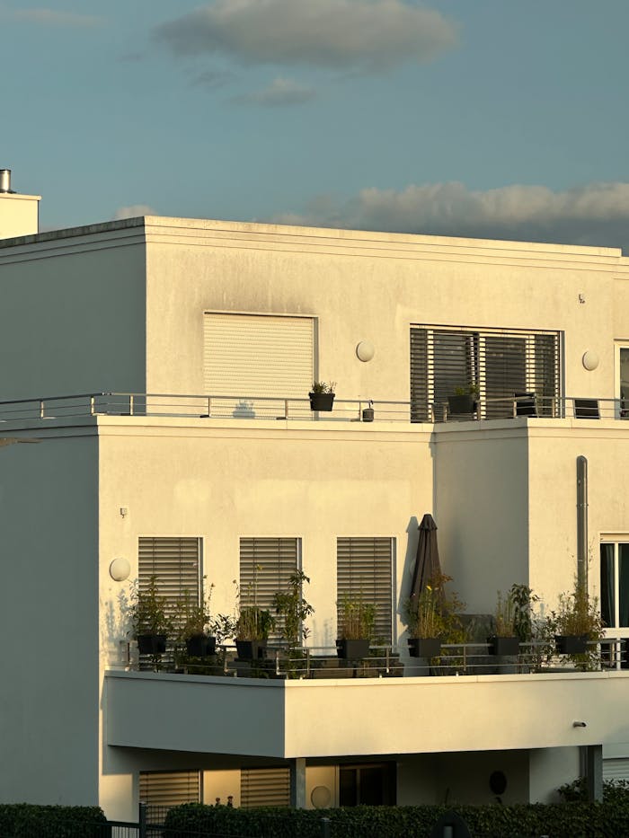 Modern White Apartment Building at Sunset